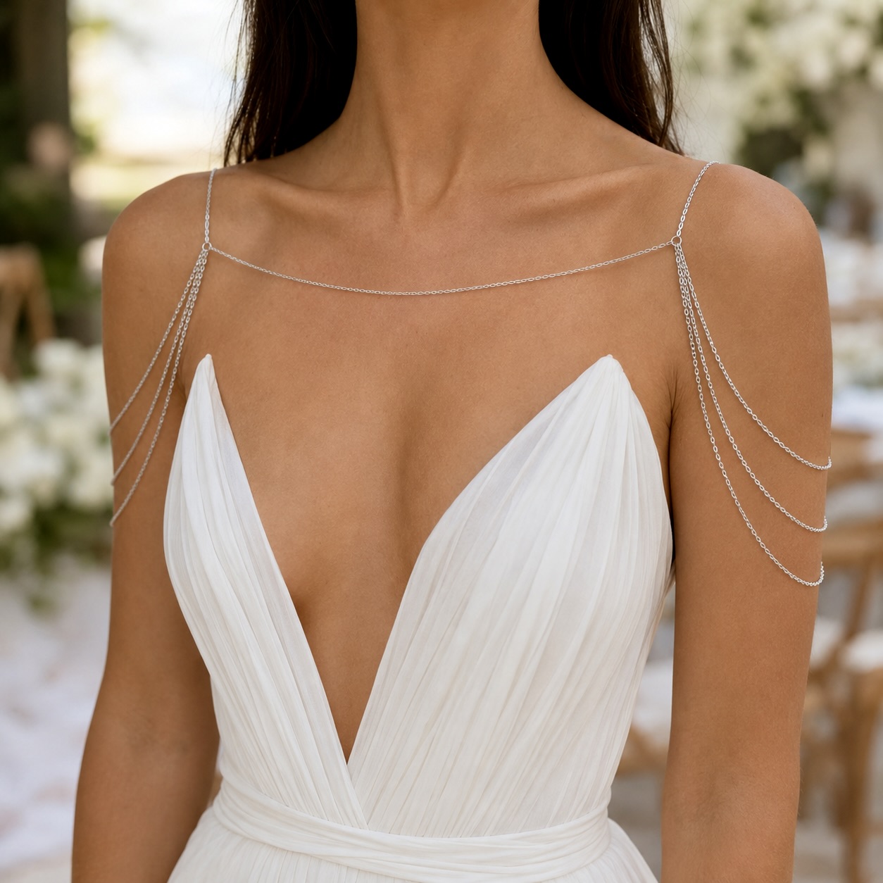 Delicate gold tone stainless steel shoulder chain draping across collarbone for layered chest jewelry styling