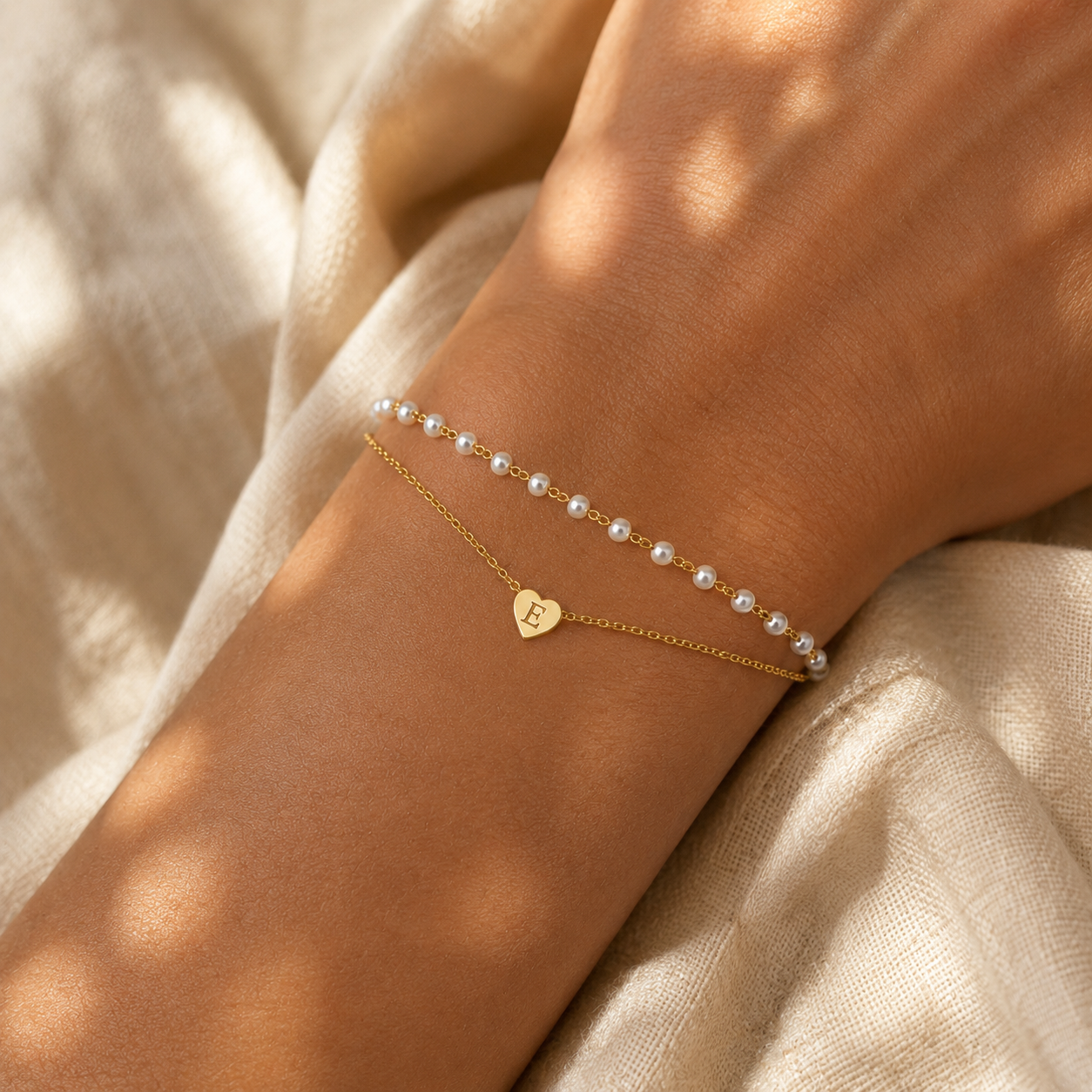 Personalized double-strand pearl bracelet with gold heart charm engraved initial, layered pearl and cable chain bracelet