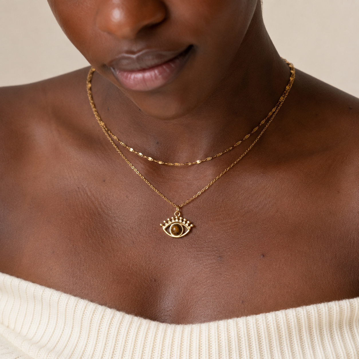 Gold-tone stainless steel double-layer choker necklace with evil eye charm and natural tiger's eye stone