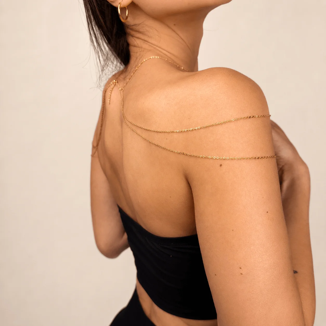 Elegant gold tone stainless steel goddess shoulder chain for special occasion jewelry and statement evening wear