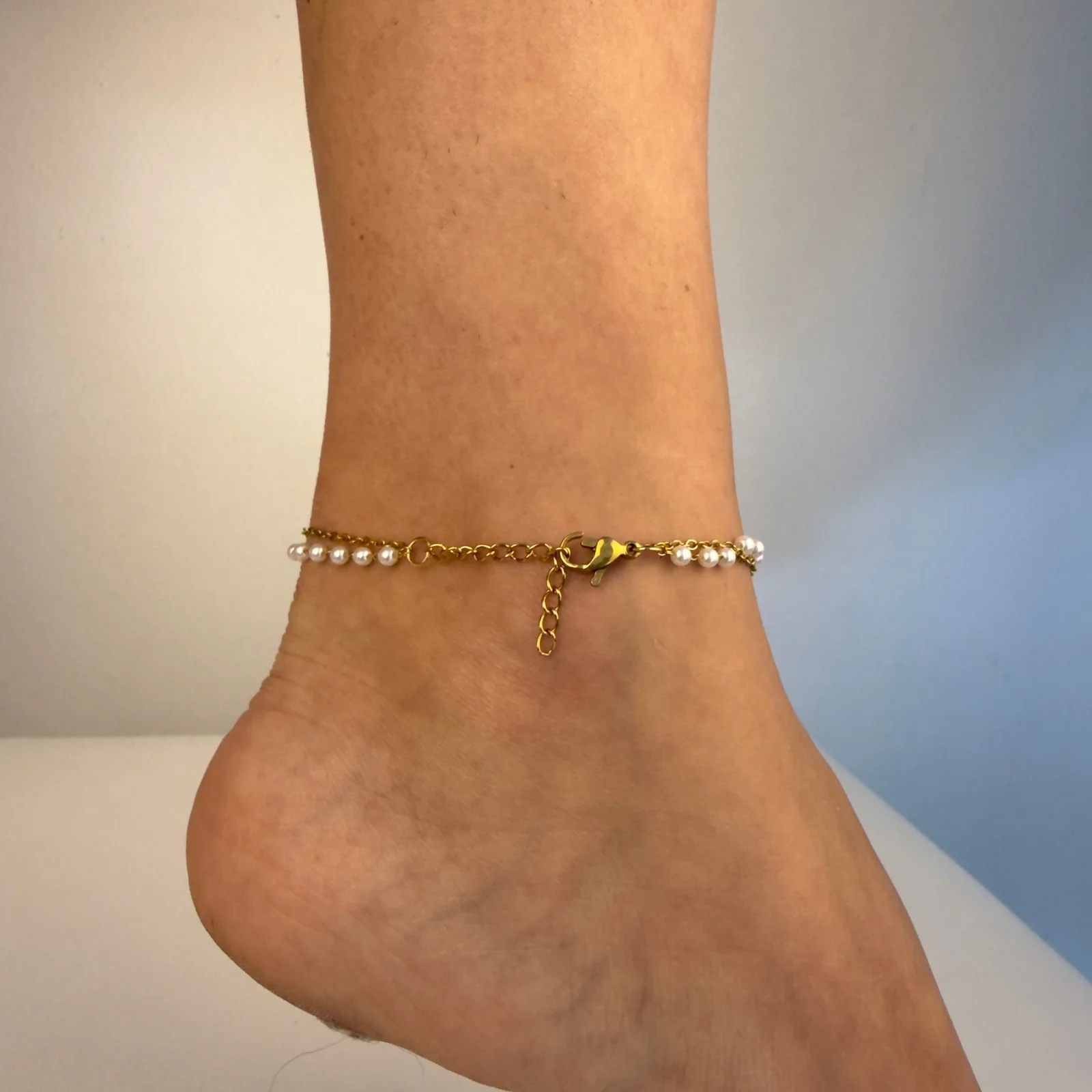 Delicate birth flower gold tone stainless steel ankle bracelet for everyday wear and beach occasions