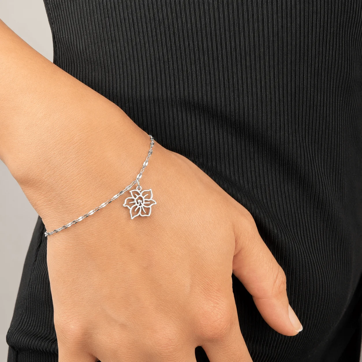 Dainty stainless steel birth flower charm bracelet in gold tone, handcrafted tarnish-resistant jewelry for everyday wear