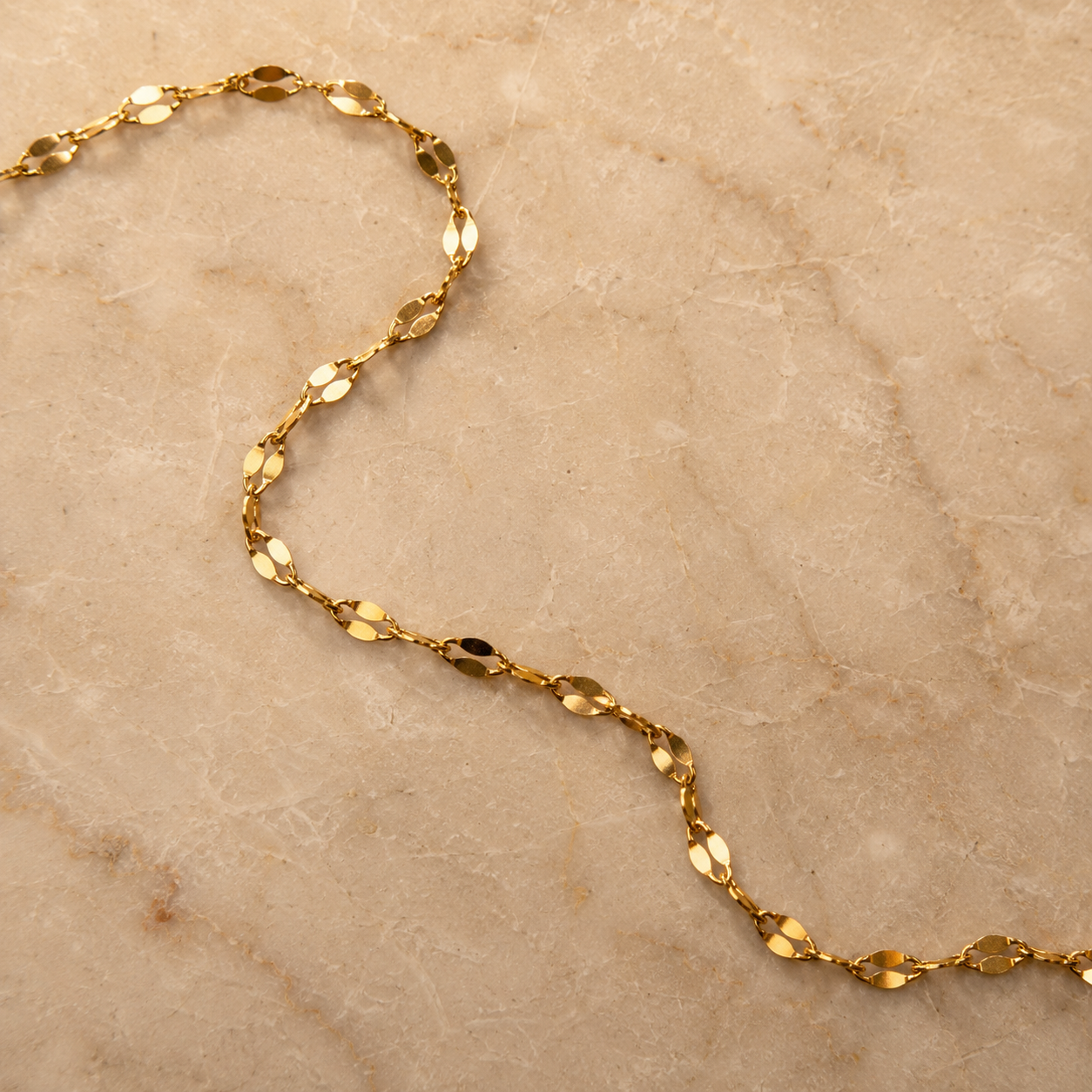 Delicate gold tone birth flower pendant necklace in stainless steel, handcrafted dainty charm necklace for everyday wear.