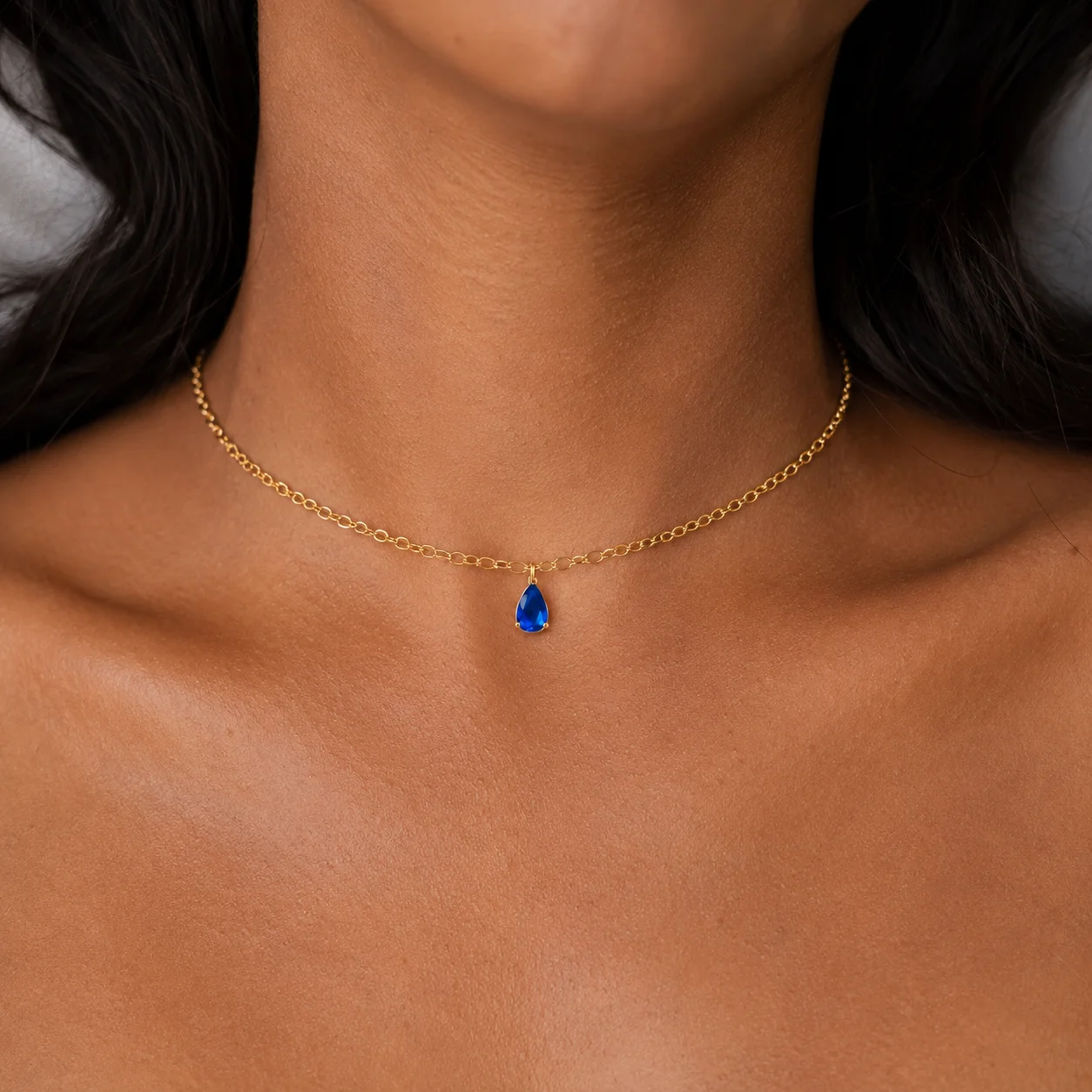 Delicate gold-tone birth month teardrop choker necklace with gemstone pendant, stainless steel waterproof design