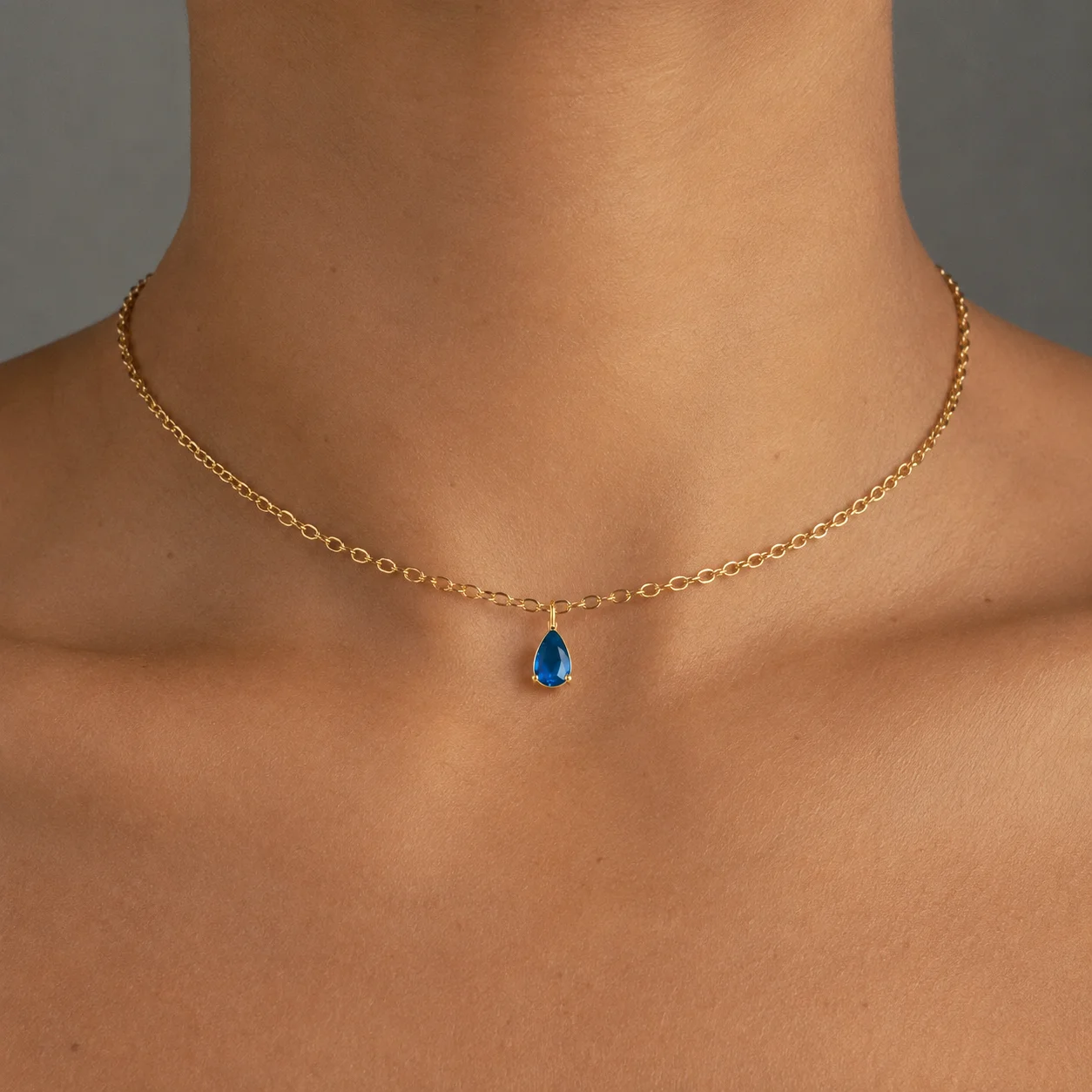 Delicate gold-tone birth month teardrop choker necklace with gemstone pendant, stainless steel waterproof design