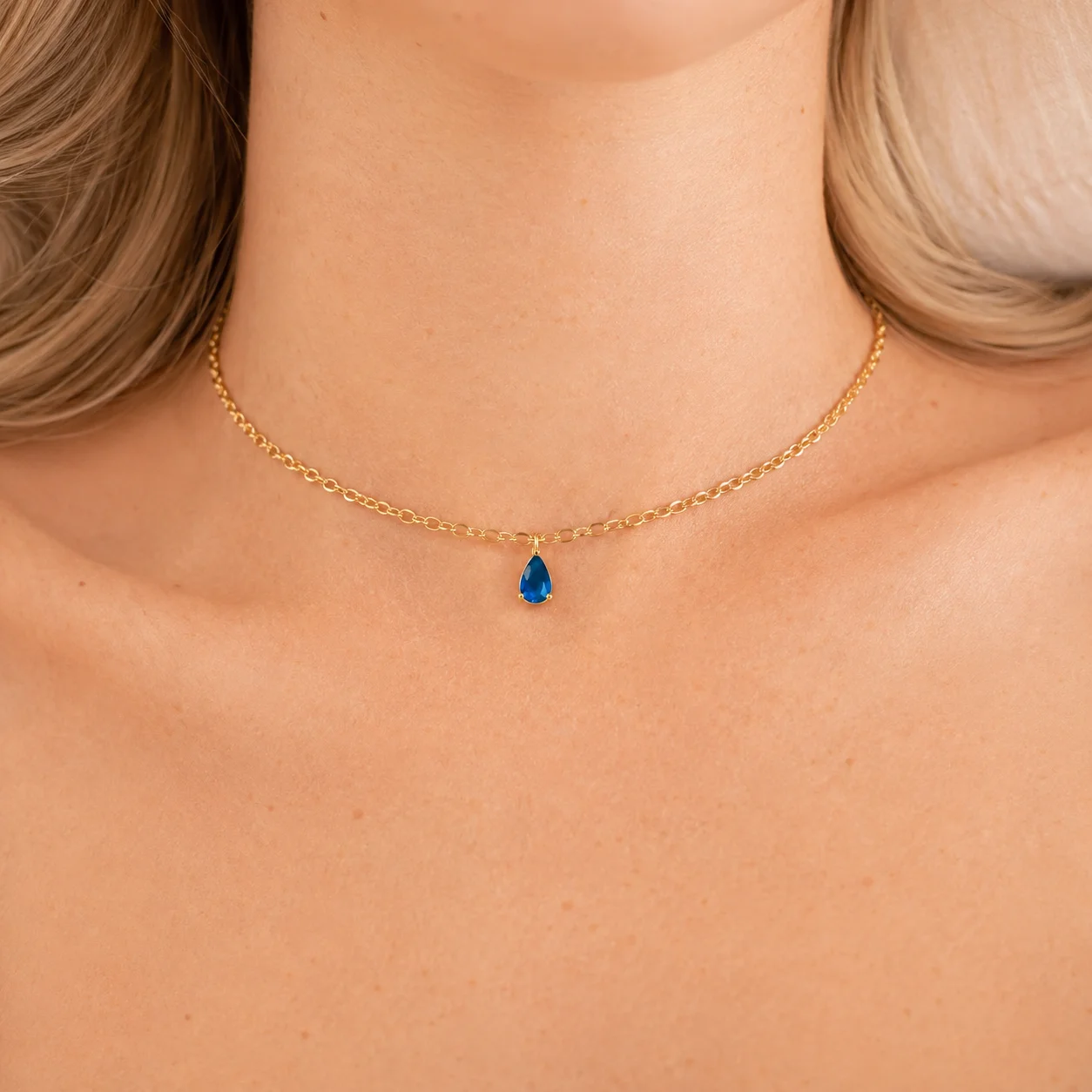 Delicate gold-tone birth month teardrop choker necklace with gemstone pendant, stainless steel waterproof design