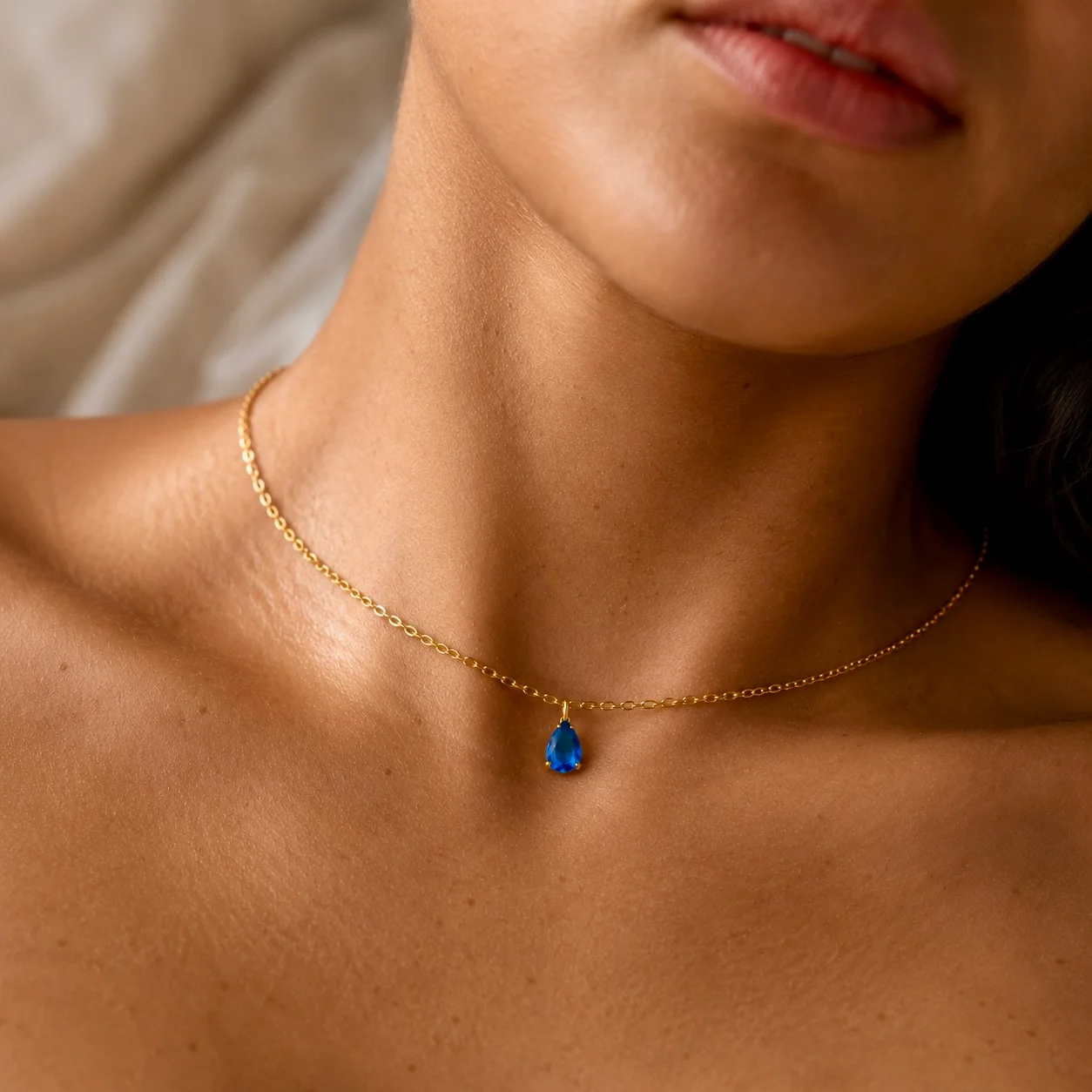Delicate gold-tone birth month teardrop choker necklace with gemstone pendant, stainless steel waterproof design