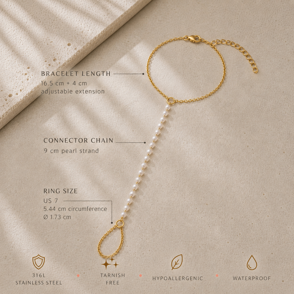 Gold-tone stainless steel pearl hand chain draped across wrist for elegant bridal hand jewelry
