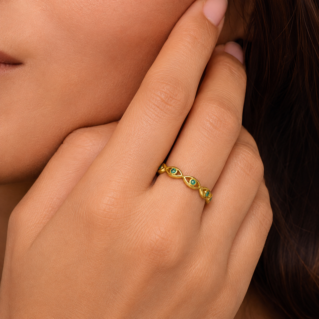 Gold evil eye woven band ring with green cubic zirconia gemstones, adjustable stainless steel ring