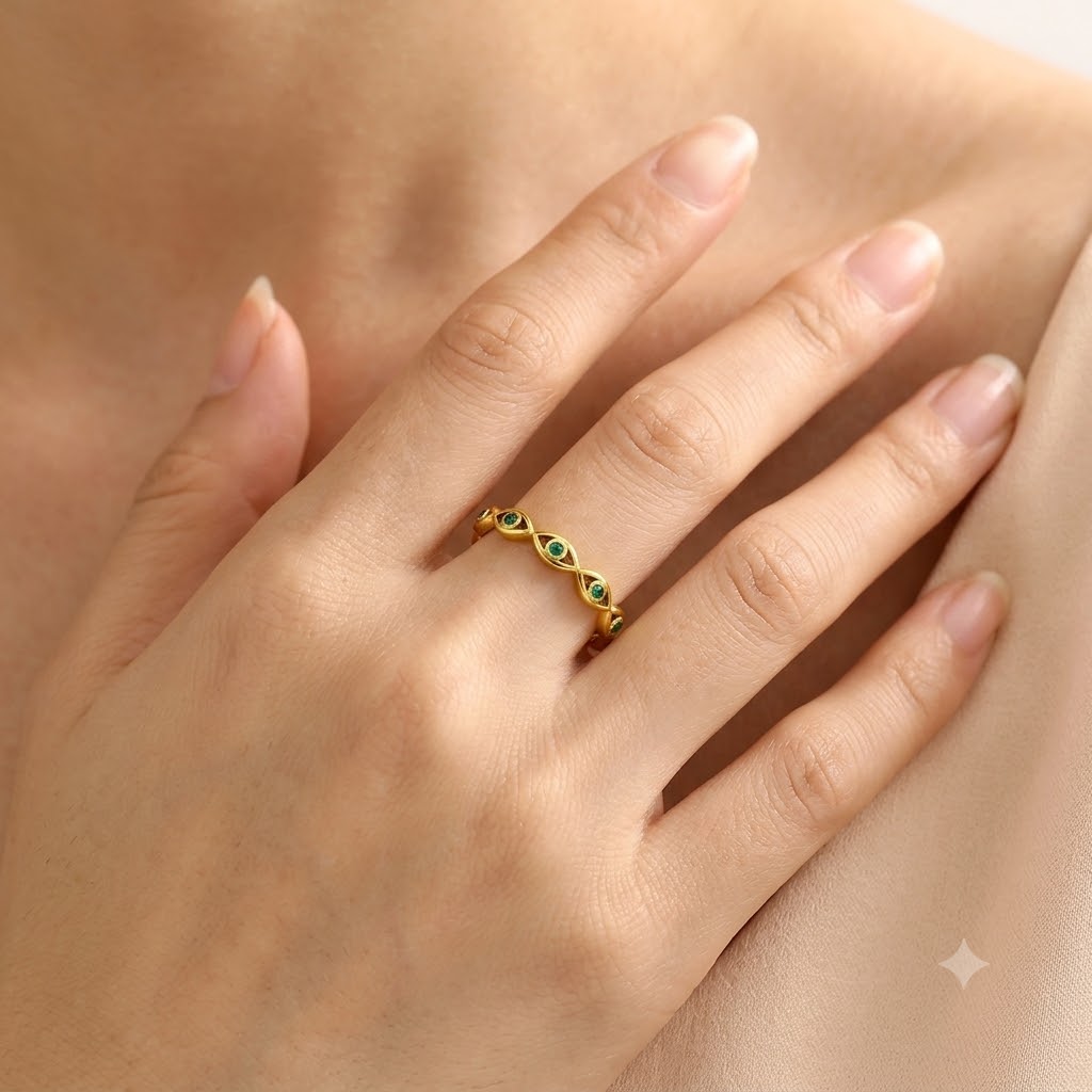 Gold evil eye woven band ring with green cubic zirconia gemstones, adjustable stainless steel ring