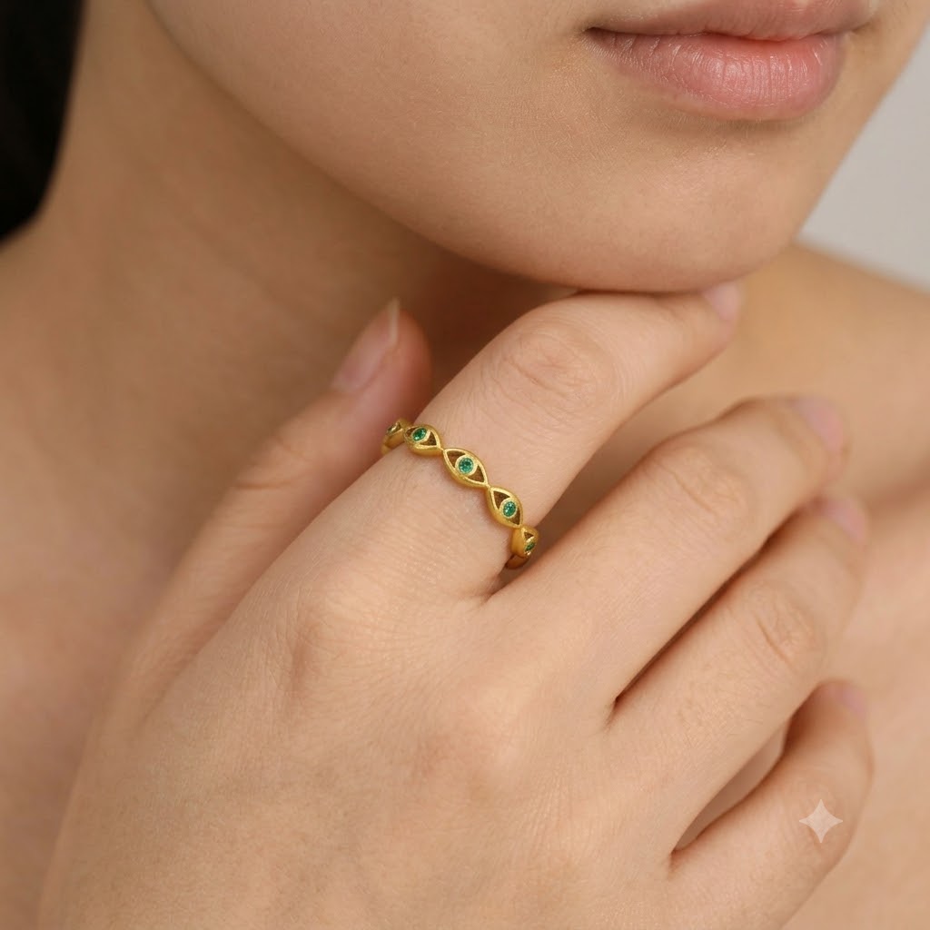 Gold evil eye woven band ring with green cubic zirconia gemstones, adjustable stainless steel ring