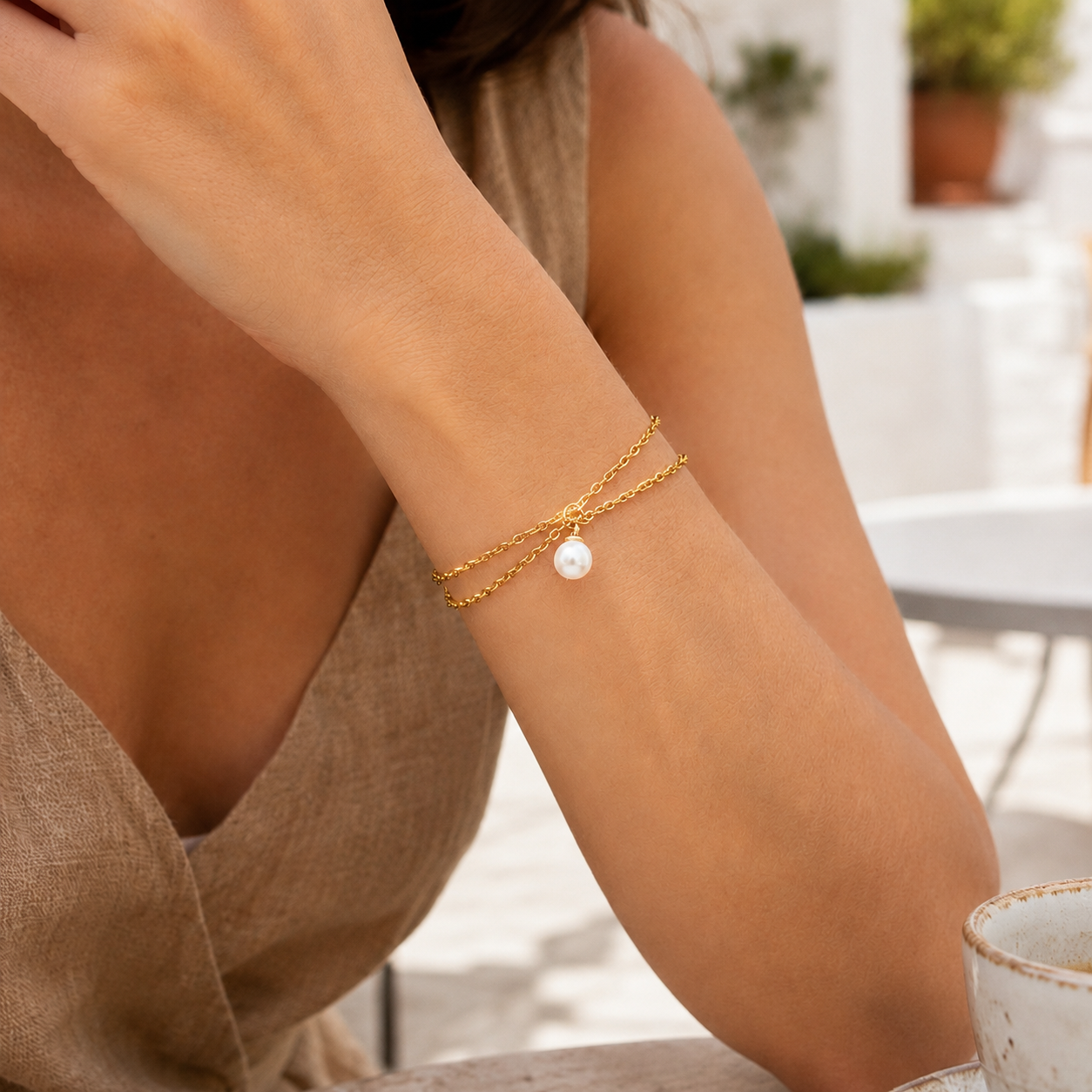 Delicate gold stainless steel pearl charm bracelet with dual strands for everyday wear