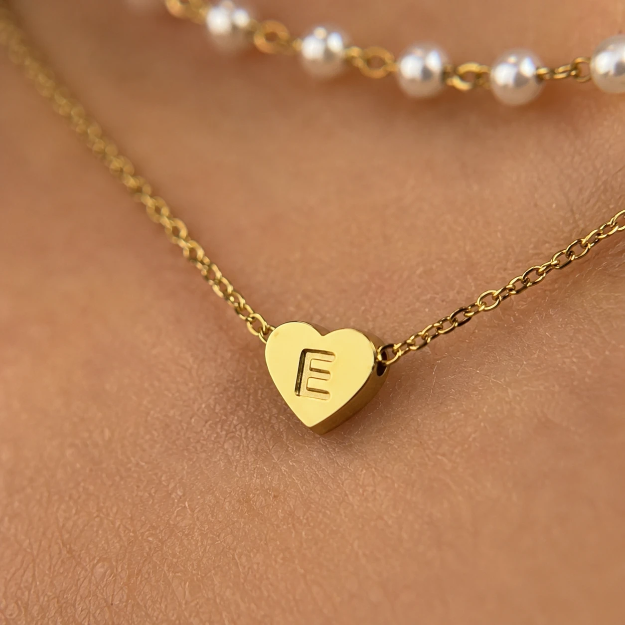 Personalized initial heart pendant necklace layered with pearl bead chain, gold-tone stainless steel choker