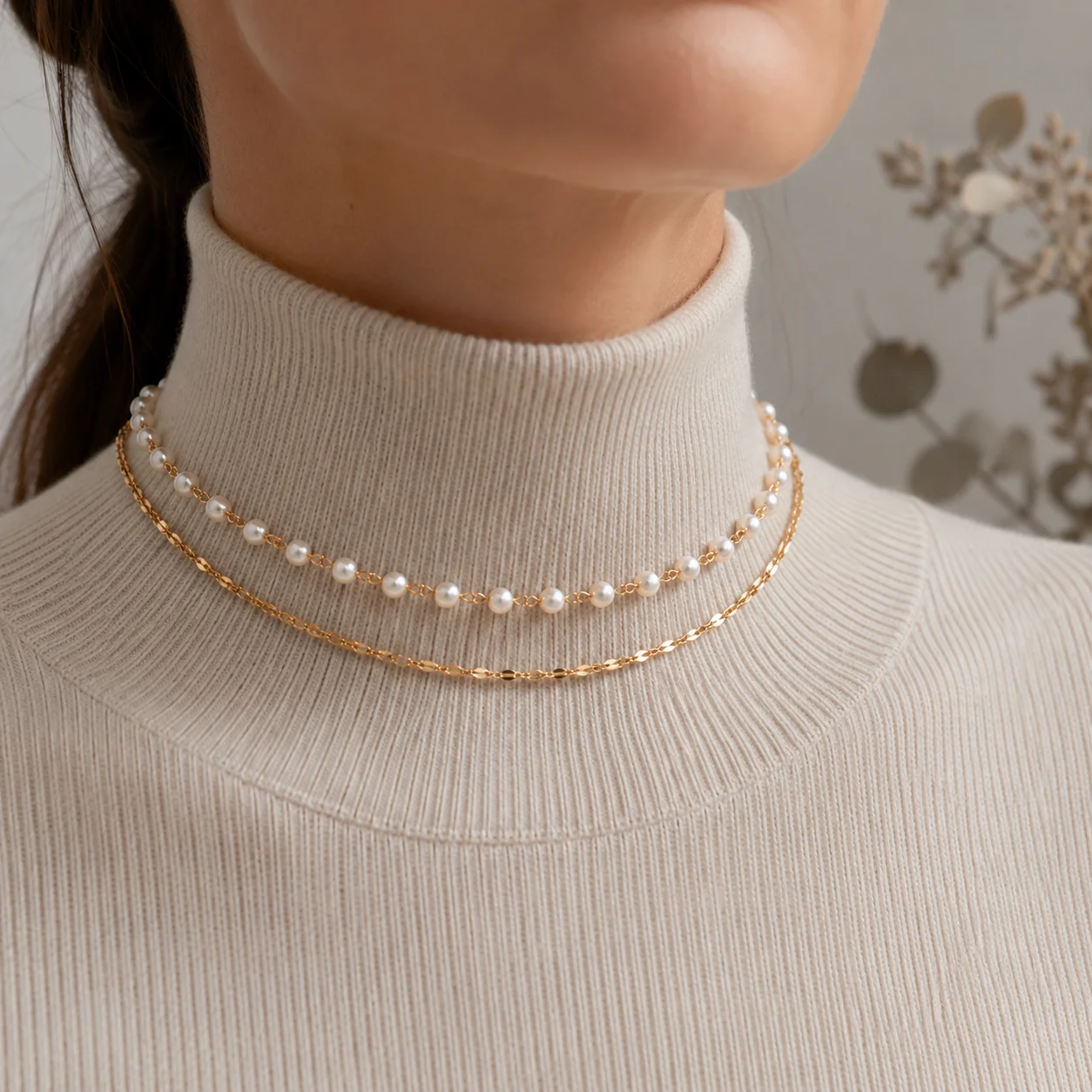 Dainty pearl bead choker necklace layered with a fine gold-tone or silver-tone cable chain in waterproof stainless steel