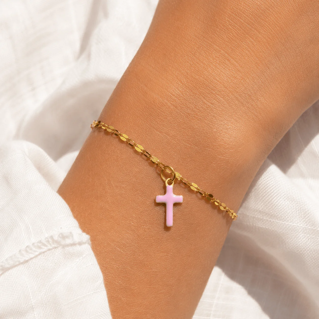 Delicate gold stainless steel bracelet with pink cross charm, dainty faith jewelry for everyday wear
