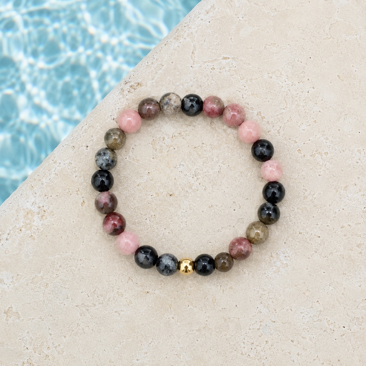 Rhodochrosite natural stone beaded stretch ring with gold stainless steel accent bead